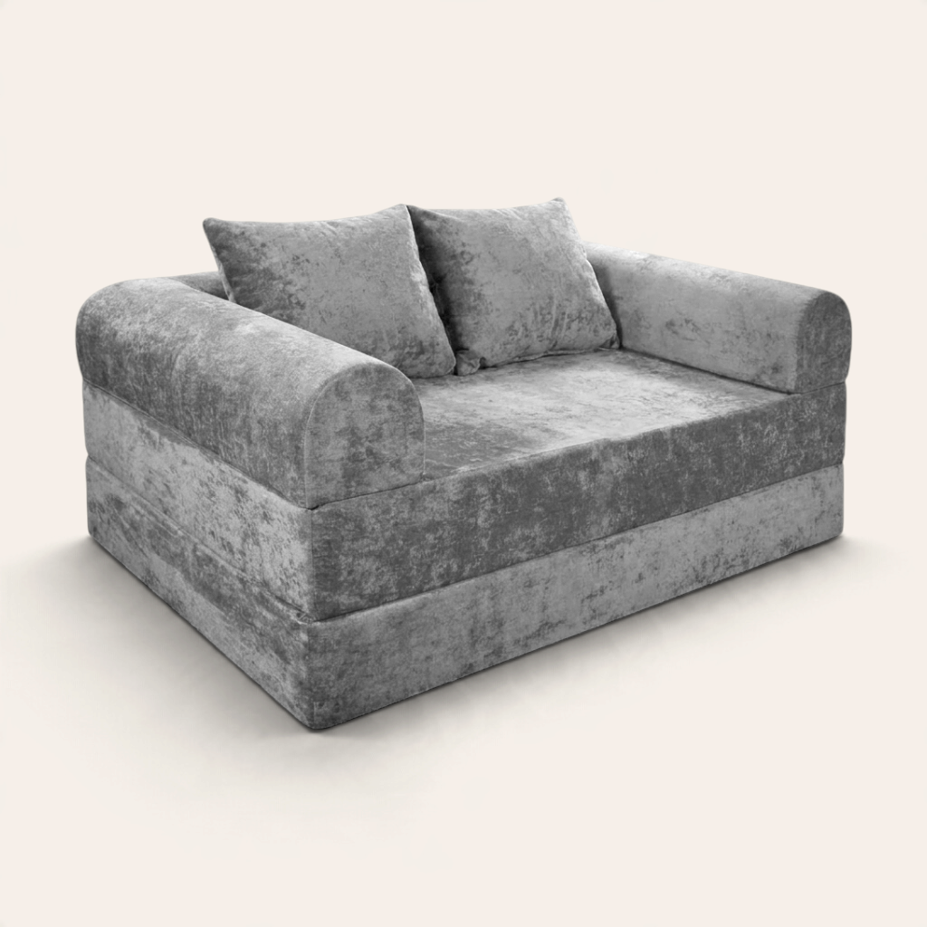 Sofá cama modular Naap Concept Teddy en color gris con textura suave, diseño sin esquinas duras y dos cojines