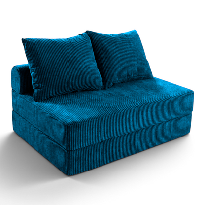 Sofá cama matrimonial Naap Concept de espuma azul con textura acanalada y diseño modular sin estructuras rígidas.
