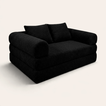 Sofá cama modular Naap Concept Teddy en color negro con textura de borreguito y diseño ergonómico sin esquinas duras
