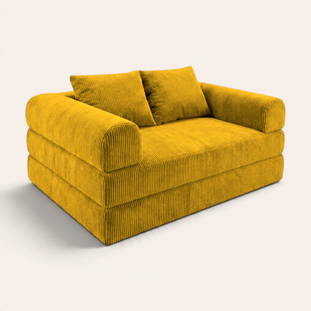 Sofá cama modular Naap Concept color mostaza con textura de pana, diseño versátil y cómodo sin esquinas rígidas.