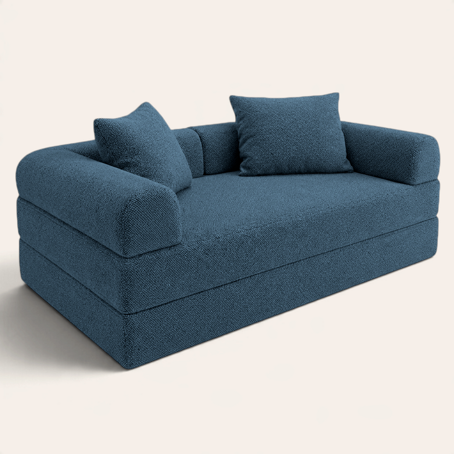 Sofá cama modular Naap Concept en color azul con textura tipo borrego, diseño ergonómico sin esquinas duras.